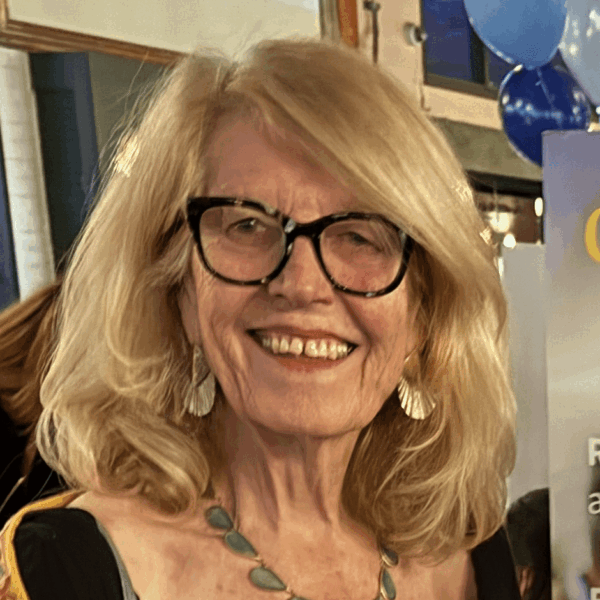 Sue-headshot-2026-e1770837349778-600x600